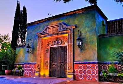 Exterior of Fonda San Miguel at night in Shoal Creek, TX